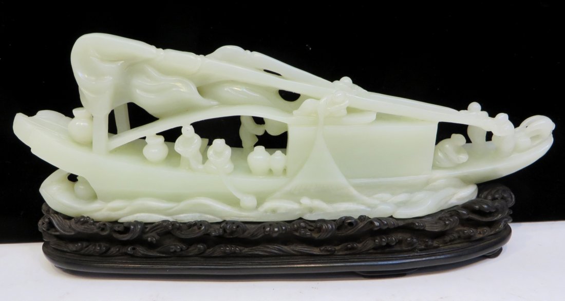 19th C. White Jade Boat: 4 1/2" tall, a sailboat leaving harbor preparing their sails, with six crew members showing. Outstanding carved "ocean with waves" base. Shipping: We are able to pack and ship this item to an address