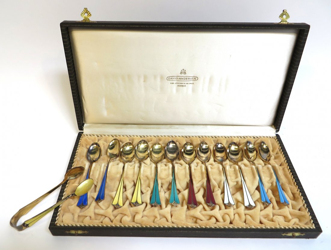 12 Gilt Silver Spoons By David Andersen: In guilloche multi-colored enamel, all together in a silk lined presentation box with a 4" silver tongs. Shipping: We are able to pack and ship this item to an address in the United States for $50.00