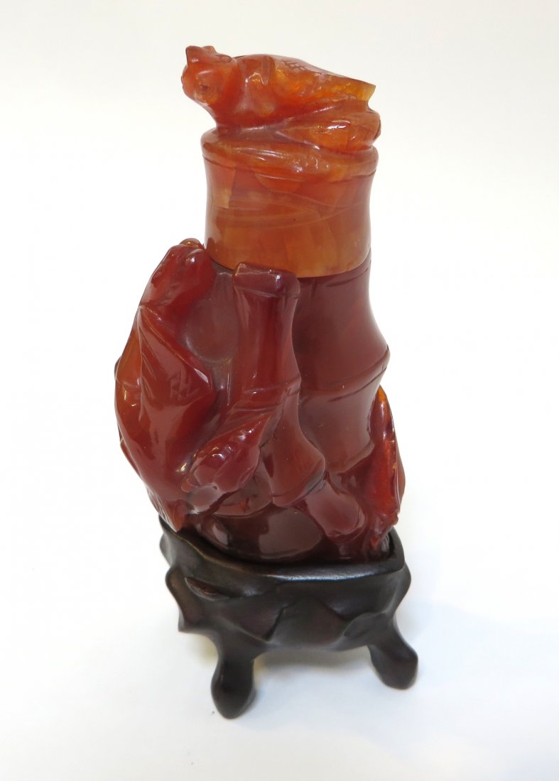 Large Agate Snuff Bottle With Stand: Large Agate snuff bottle with stand. 120 mm tall Shipping: We are able to pack and ship this item to an address in the United States for $25.00 via USPS Priority Mail. Tracking information will be sen