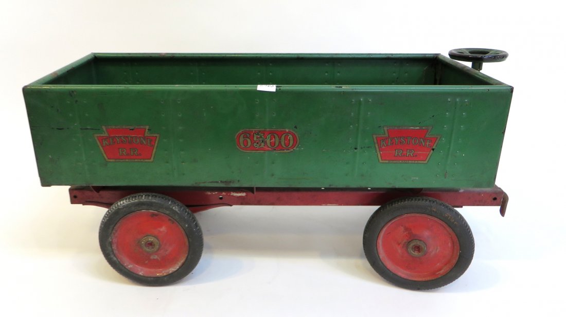 Keystone Toy Coal Car Toy Train: A green painted coal car equipped with steering, about 20" in length. Shipping: We are able to pack and ship this item to an address in the United States for $55.00 via USPS Priority Mail or via FedEx