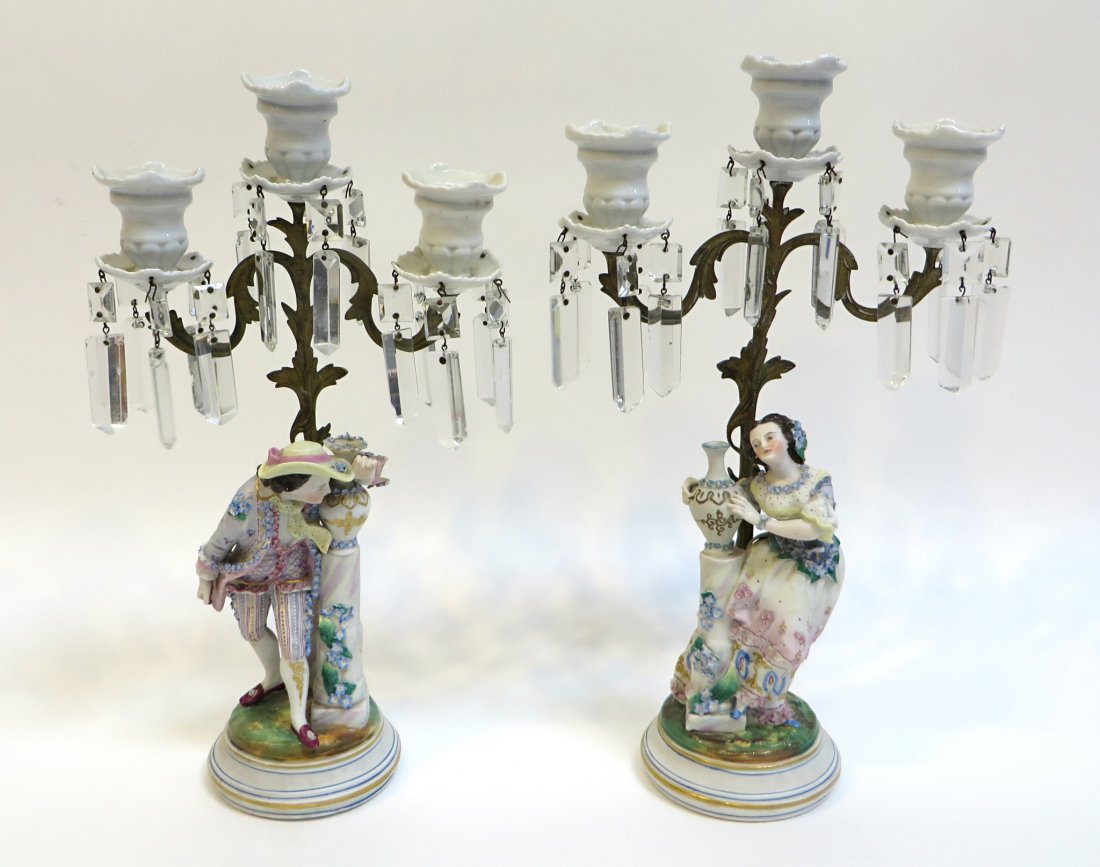 Pair Bisque Ware Candelabra: A pair of 14" candelabra featuring ormolu supports and polychrome figurines, each base numbered 582. The man with repairs to the backside of the base and support. Shipping: We are able to pack and shi