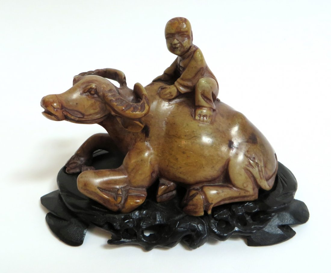Chinese Soapstone Child Riding Water Buffalo: Chinese Soapstone Child Riding Water Buffalo: Description: Mounted onto a custom wood stand. Dimensions: 6" X 4" with stand $200 - $4