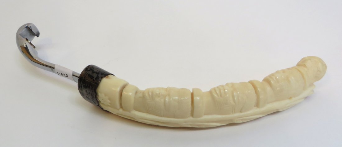 Antique Ivory Bottle Opener: Antique Ivory Bottle Opener: Dimensions: 9" long $100 - $200 Provenance: This lot was purchased during a tour of Asia in the 1950's and imported to