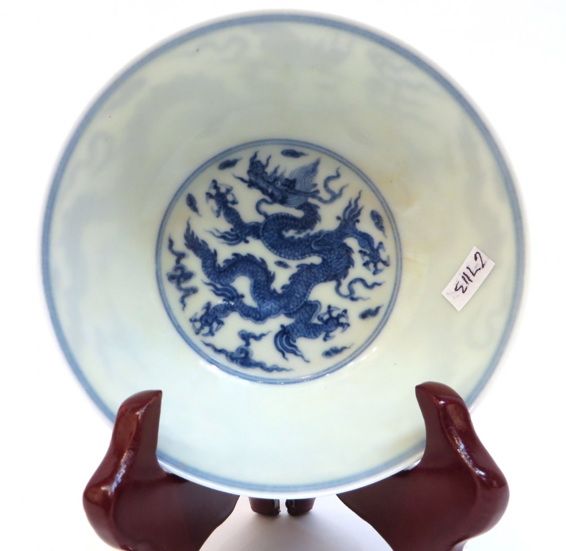 Chinese Blue & White Dragon Bowl: Chinese Blue & White Dragon Bowl: Description: One interior blue dragon with two exterior dragons in blue. Six character mark on the bottom. Dimensions: