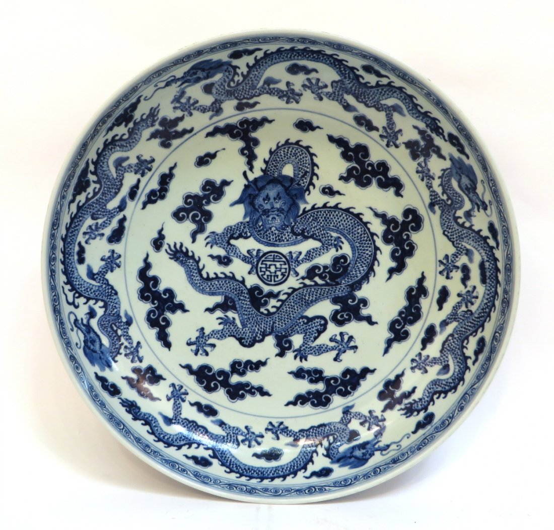 Yongzheng Style Blue & White Charger: Yongzheng Style Blue & White Charger: Description: A four inch high hand decorated shallow bowl featuring coiled blue dragons in the interior and exterior. Mark on bottom.