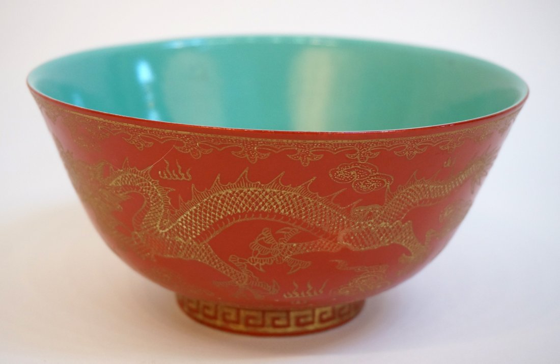 Qianlong Gold Painted Dragon Bowl: Qianlong Gold Painted Dragon Bowl: On dark orange ground with turquoise interior. A very detailed painting in gold of a dragon with flaming pearl. Meander pattern on foot. Qian Long mark on bottom.</