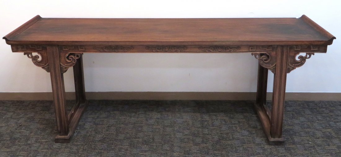 Huanghuali Altar Table: Huanghuali Altar Table: A altar table in Huanghuali with carved flowing patterns. Top composed of single solid board. Edge is carved with bead throughout. Legs and apron are beautifully carved in rel
