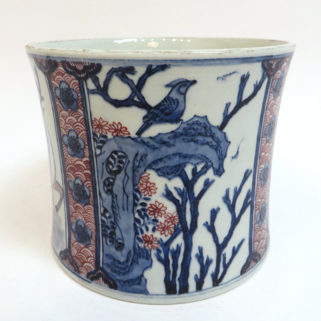 Chinese Porcelain Brush Pot: Chinese Porcelain Brush Pot: In blue, white, and red with segmented scenes of a man and deer in the forest and birds perched in trees. Six character mark on the bottom. 7 1
