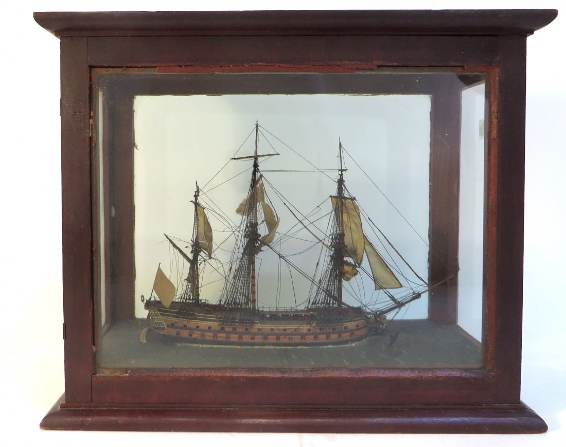 19th C. " Man Of War" Frigate Model Under Glass: 19th C. " Man Of War" Frigate Model Under Glass: Or ship of the line, circa 1790-1800. The model has plaster sea waves supporting a frigate, all displayed within a wooden housing with panel