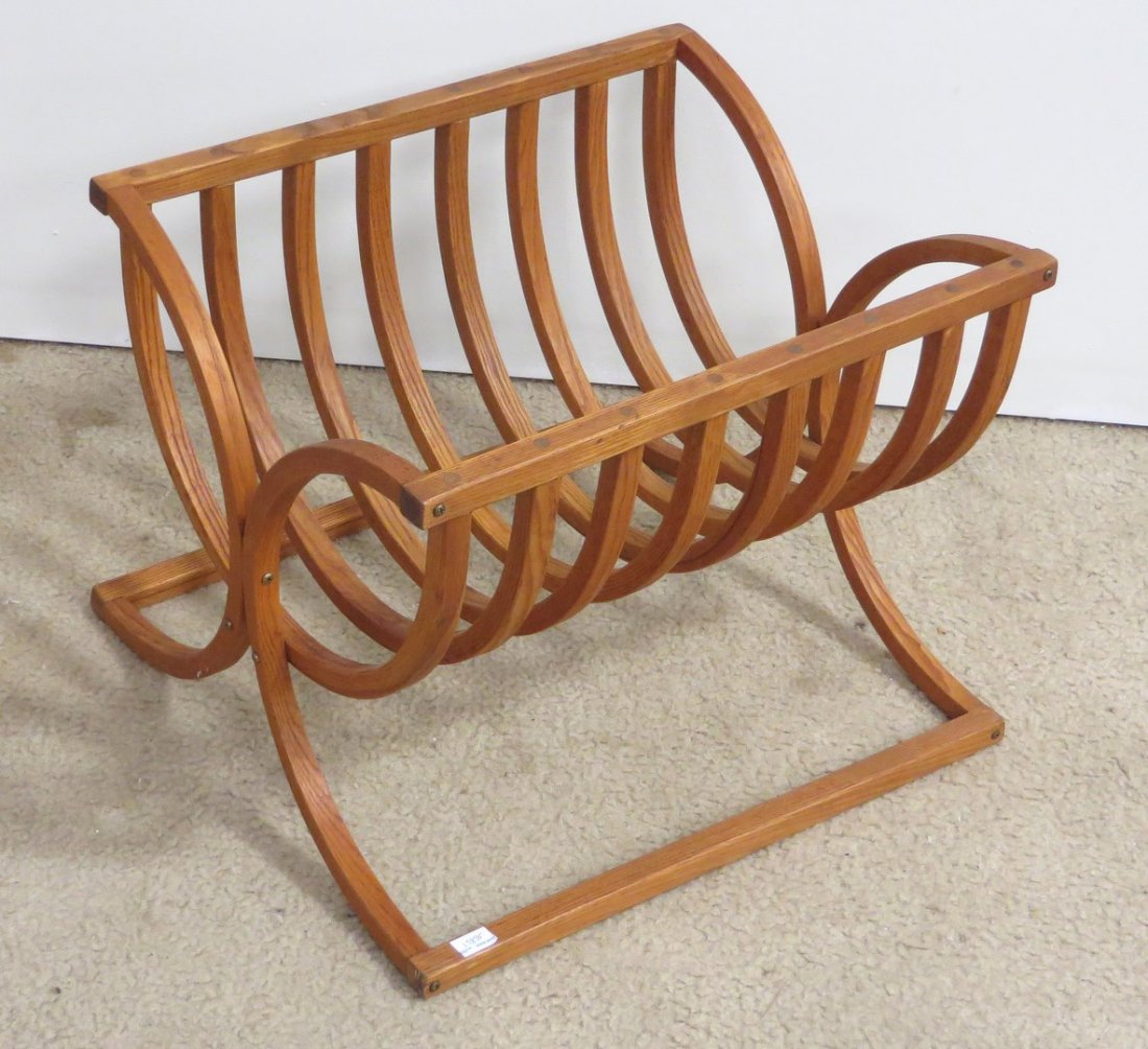 Magazine Rack: Magazine Rack: A shaped oak, modernly designed magazine rack. 21" X 15 1/2" $40 - $80 Shipping: We are able to pack and s
