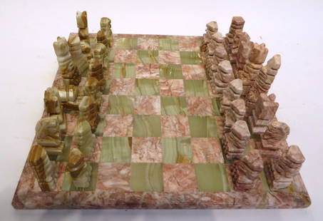 Onyx And Marble Chess Set: Onyx And Marble Chess Set : A chess set made of onyx and marble. Pink marble and green onyx pieces. Two knights and one king are damaged. NO RESERVE on this lot. Most items in this sale have no reser