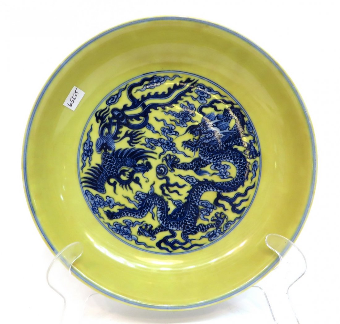 Yongzheng Yellow Dragon Bowl: Yongzheng Yellow Dragon Bowl: A yellow Yongzheng dragon bowl with a blue dragon and phoenix in the center of the interior and the exterior. Six character mark on the bottom