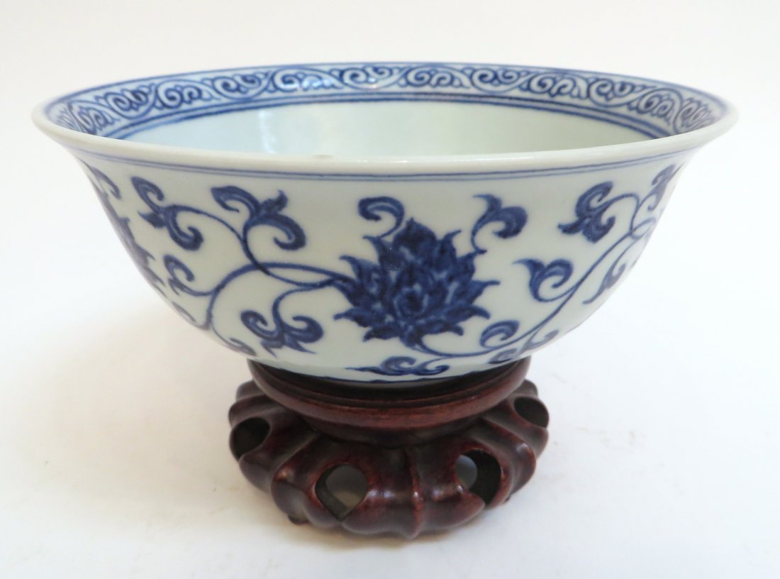 Blue & White Ming Dynasty Bowl With Stand: Blue & White Ming Dynasty Bowl With Stand: Flowers and tendrils surround the exterior and a circular medallion of a flower with a border of vines at the rim are inside the bowl. The border at the