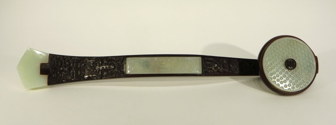 CHINESE ZITAN AND JADE RUYI: Chinese Zitan And Jade Ruyi : The carved Zitan wood wish-granted-wand having elongated s-curved wand, with head. The circular ruyi head is hand carved in a hobnail pattern with applied carved wooden