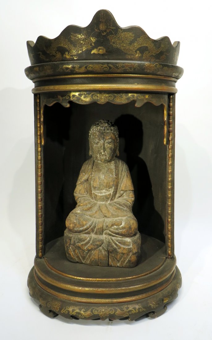 CHINESE MING DYNASTY WOODEN BUDDHA SHRINE: Chinese Ming Dynasty Wooden Buddha Shrine: A gilt wood vessel depicting a shrine with Buddha. The paint on the shrine features dragons with flaming pearls. The finish has crackle and is faded appropr