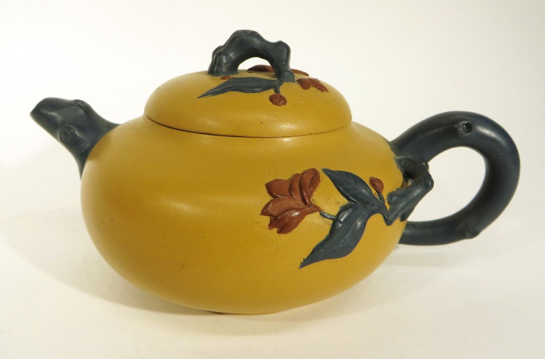 YIXING TAN AND BLUE TEA POT: Yixing Tan And Blue Tea Pot: Yixing teapots are smaller than their western counterparts as the tea is often brewed for only a few seconds before it is served to guests.[citation needed] Reusing the s