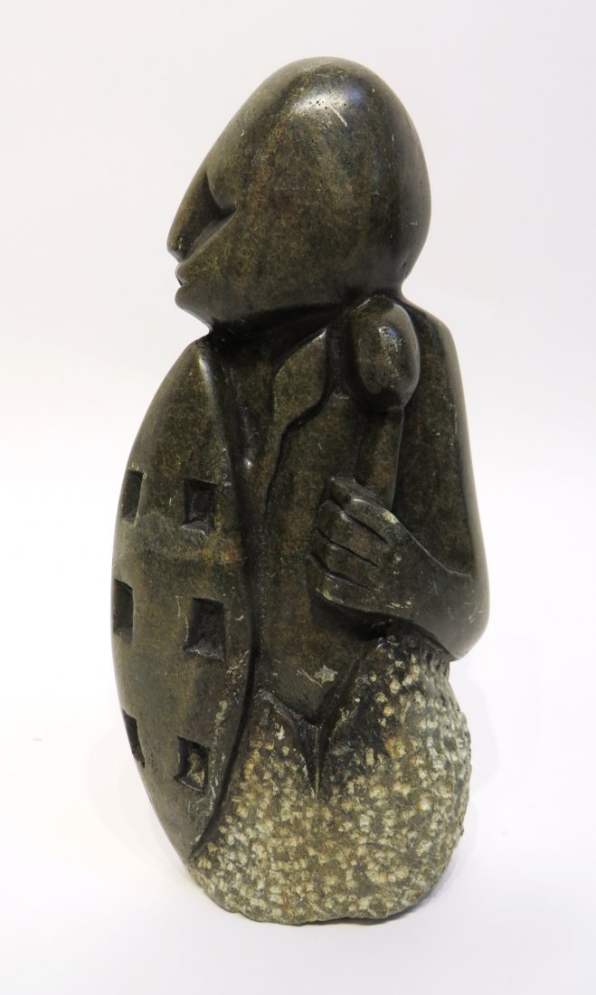 STONE AFRICAN CARVING: Stone African Carving: A carving of a man with shield and spear. 6 1/2" $60 - $180 Shipping: We are able to pack and ship this