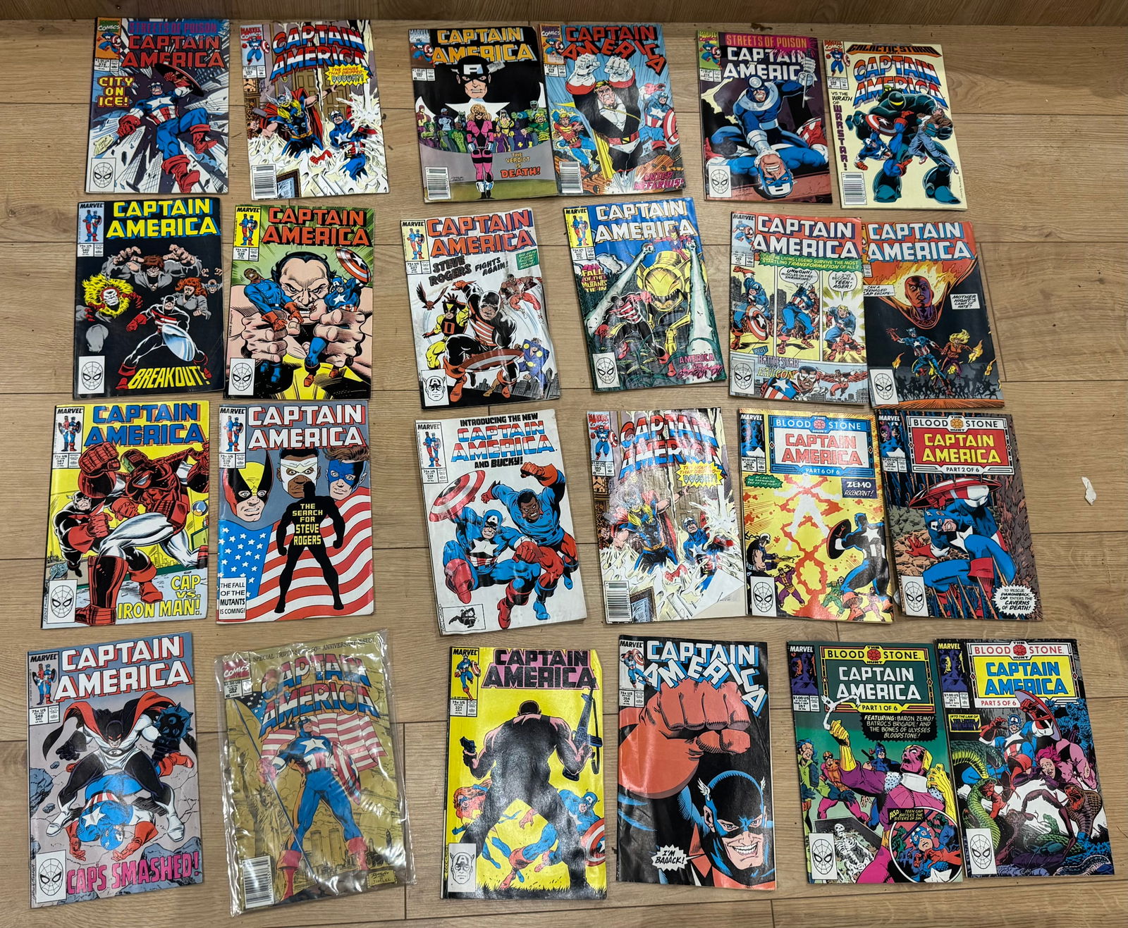 24 Captain America Comic Book Collection: A collection of Marvel Captain America comic book issues, primarily from the 1980s 1990s, featuring classic storylines, strong cover art, and appearances by major Marvel characters and villains.