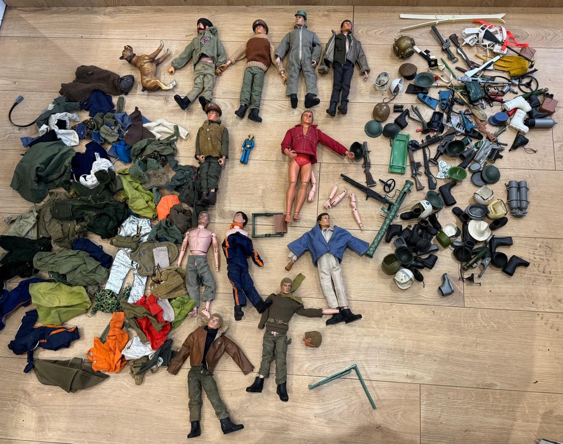 collection of vintage Palitoy Action Man figures and accessories.: figures feature "realistic hair" (flocked hair) and "gripping hands" technology, introduced around 1970. The collection includes various military-themed clothing, helmets, and weapons. 1st 7 and the