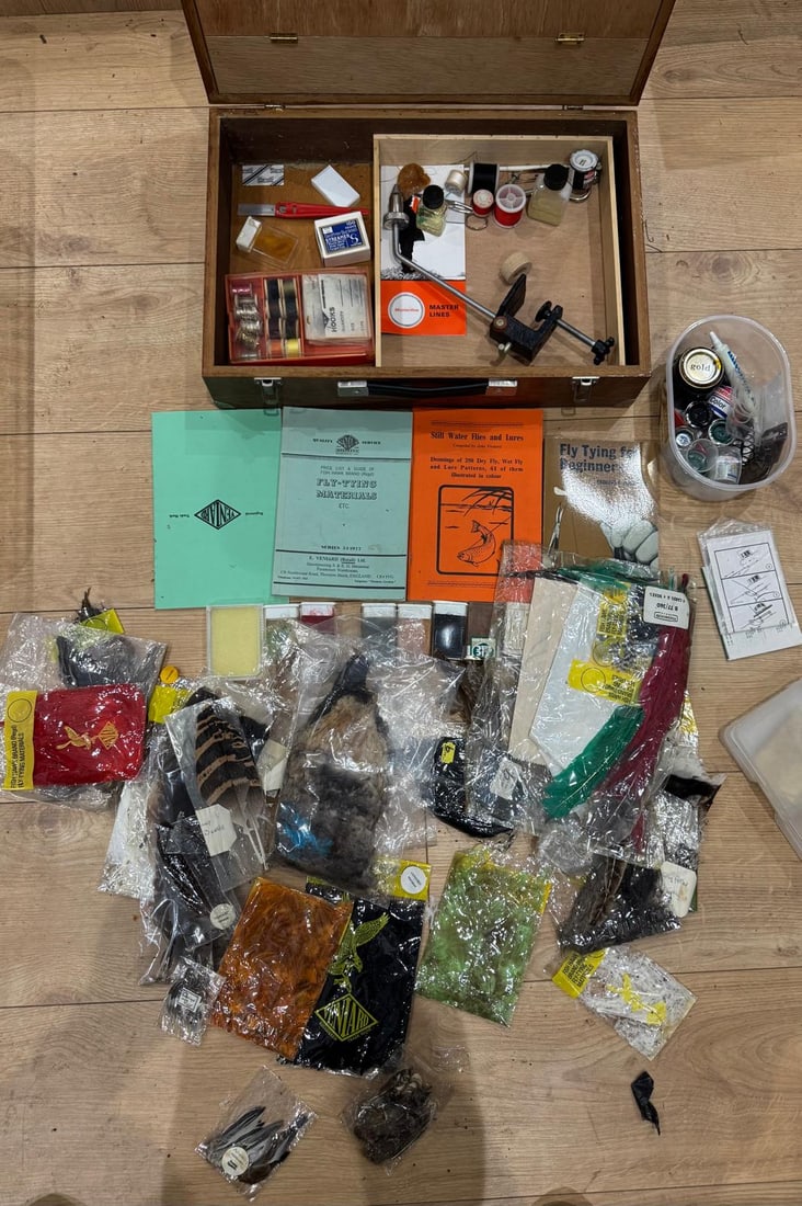 Fly fishing Tying Materials, Tools and Books: A comprehensive collection of fly tying materials and equipment, comprising a fitted wooden fly-tying box containing tools, threads, waxes, hooks, varnishes and accessories; together with a quantity