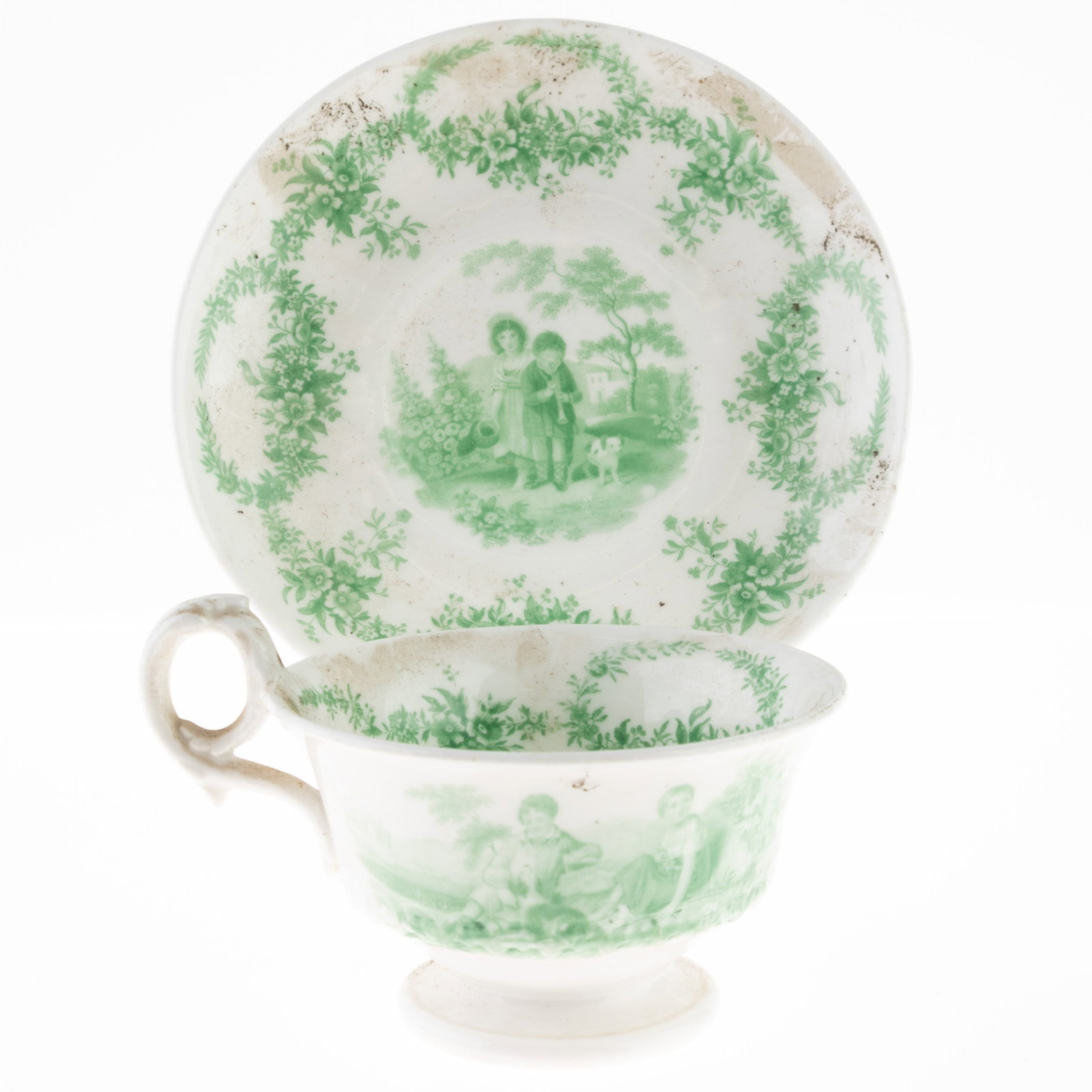 Antique Victorian Green Transferware Porcelain Teacup And Saucer Depicting Children With Dog: Height: 6.5 cm, Width: 15.0 cm. It is the responsibility of the Buyer to carefully examine each lot and form their own judgment regarding its condition, description, provenance, and authenticity prior