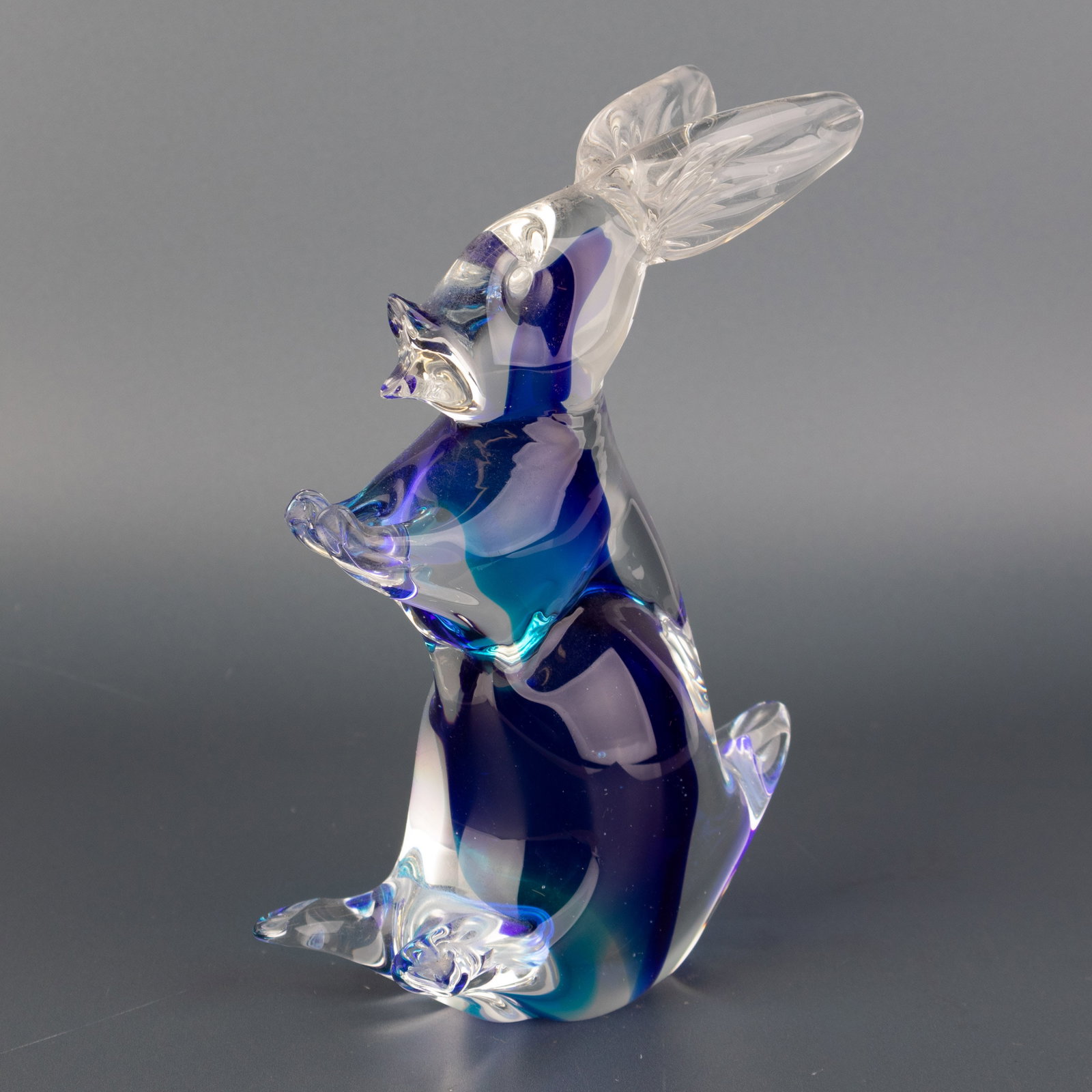 Mid Century Murano Hand Blown Venetian Blue Sommerso Glass Rabbit Sculpture: Height: 16.5 cm, Width: 11.0 cm. It is the responsibility of the Buyer to carefully examine each lot and form their own judgment regarding its condition, description, provenance, and authenticity prio