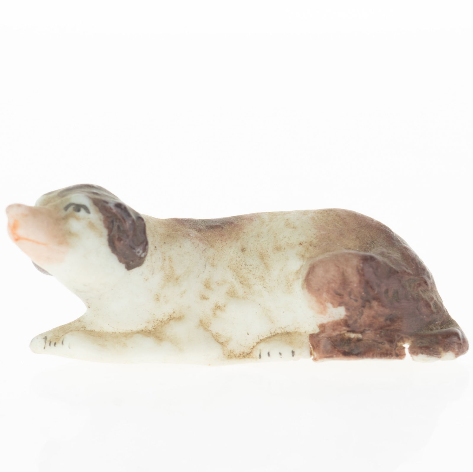 Antique German Hand Painted Bisque Porcelain Recumbent Dog Figurine Model Early 20Th Century: (Height: 1.6 cm, Width: 5.0 cm) It is the responsibility of the Buyer to carefully examine each lot and form their own judgment regarding its condition, description, provenance, and authenticity prior