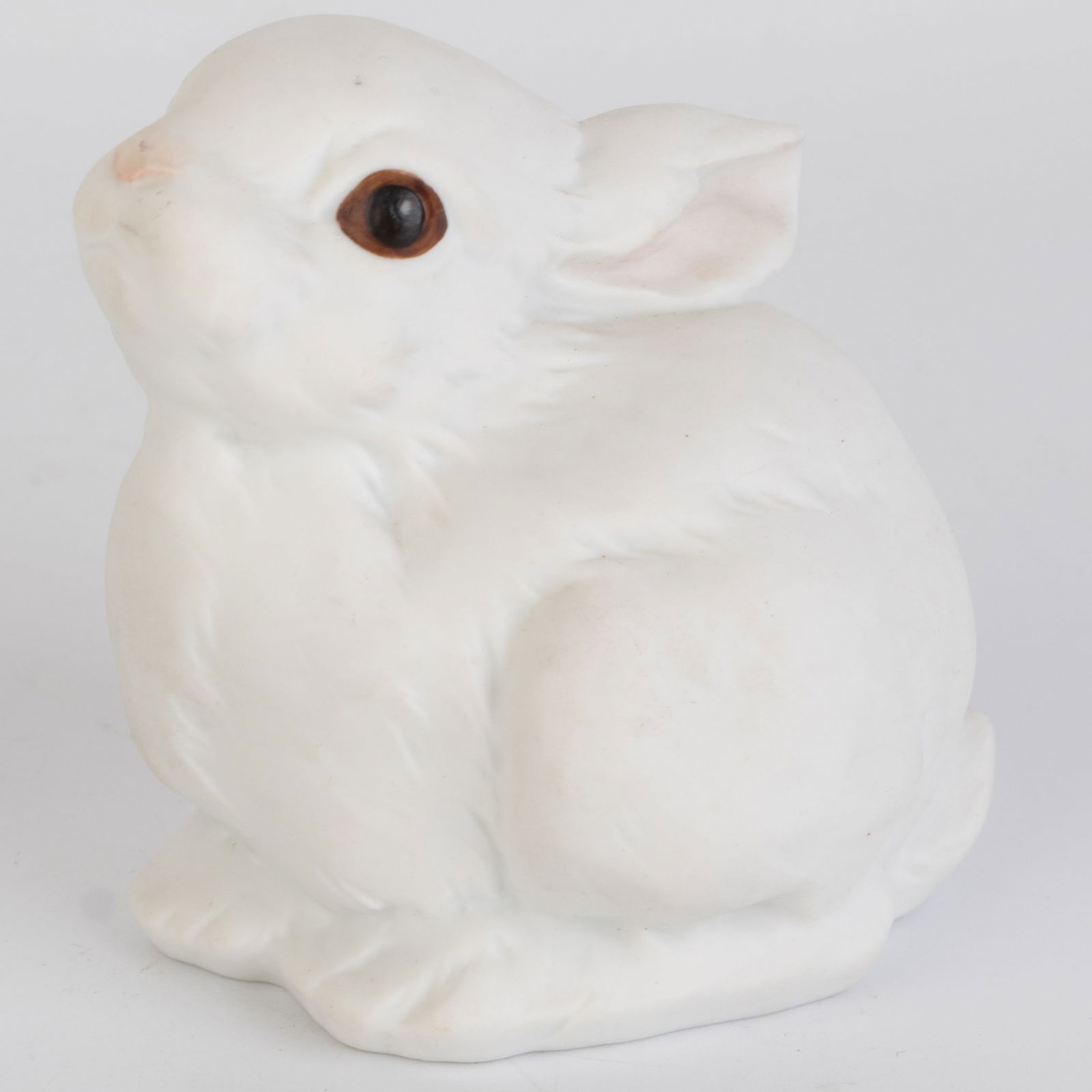 West German Kaiser Bisque Porcelain Seated Bunny Rabbit Figurine: (Height: 6.2 cm, Width: 6.5 cm) It is the responsibility of the Buyer to carefully examine each lot and form their own judgment regarding its condition, description, provenance, and authenticity prior