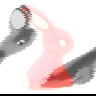 Red Ceramic Bunny Figurine with White Details and Upright Ears: 359. Red Ceramic Bunny Figurine with White Details and Upright Ears This vivid red bunny figurine features crisp white accents and tall ears?a fun retro addition to your springtime décor. It is the r