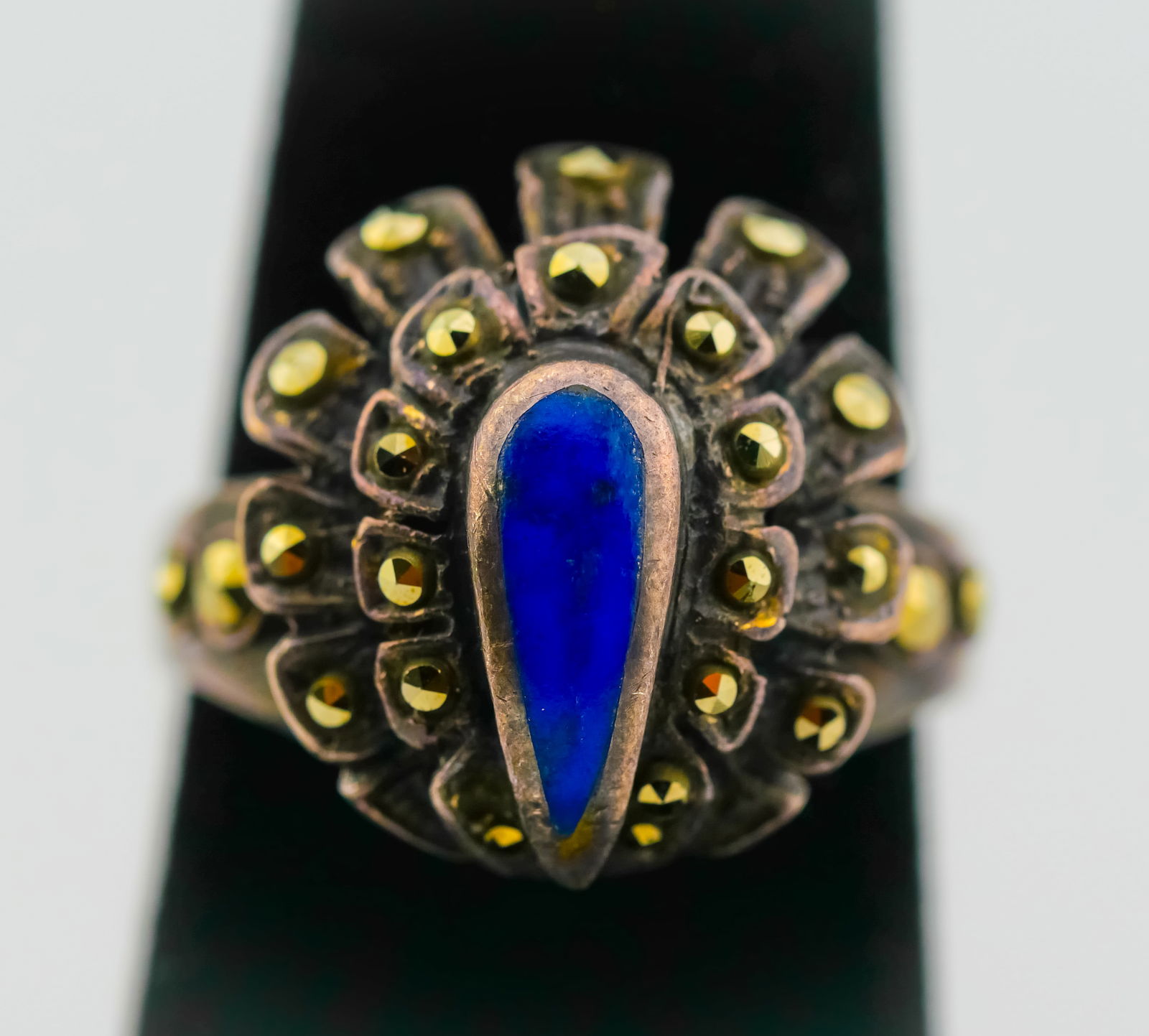 Vintage Marcasite & Cobalt Blue Statement Ring, Peacock Fan Design: This striking vintage ring is a true showstopper, designed with flair and drama in mind! Shaped in a regal fan or peacock-feather motif, this piece features shimmering marcasite stones surrounding a b