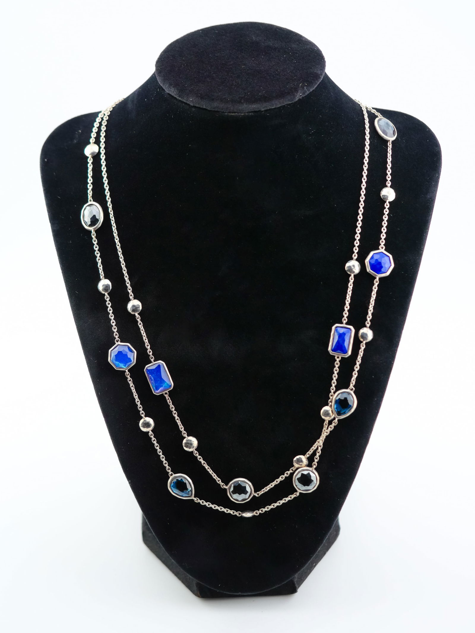 Gorgeous Ippolita 925 Sterling Silver Multi-Shape Faceted Glass Station Necklace - Signature Glamour: A dazzling piece from renowned designer Ippolita! This long sterling silver station necklace features bezel-set faceted glass stones in a striking palette of deep sapphire blue and jet black. With a m