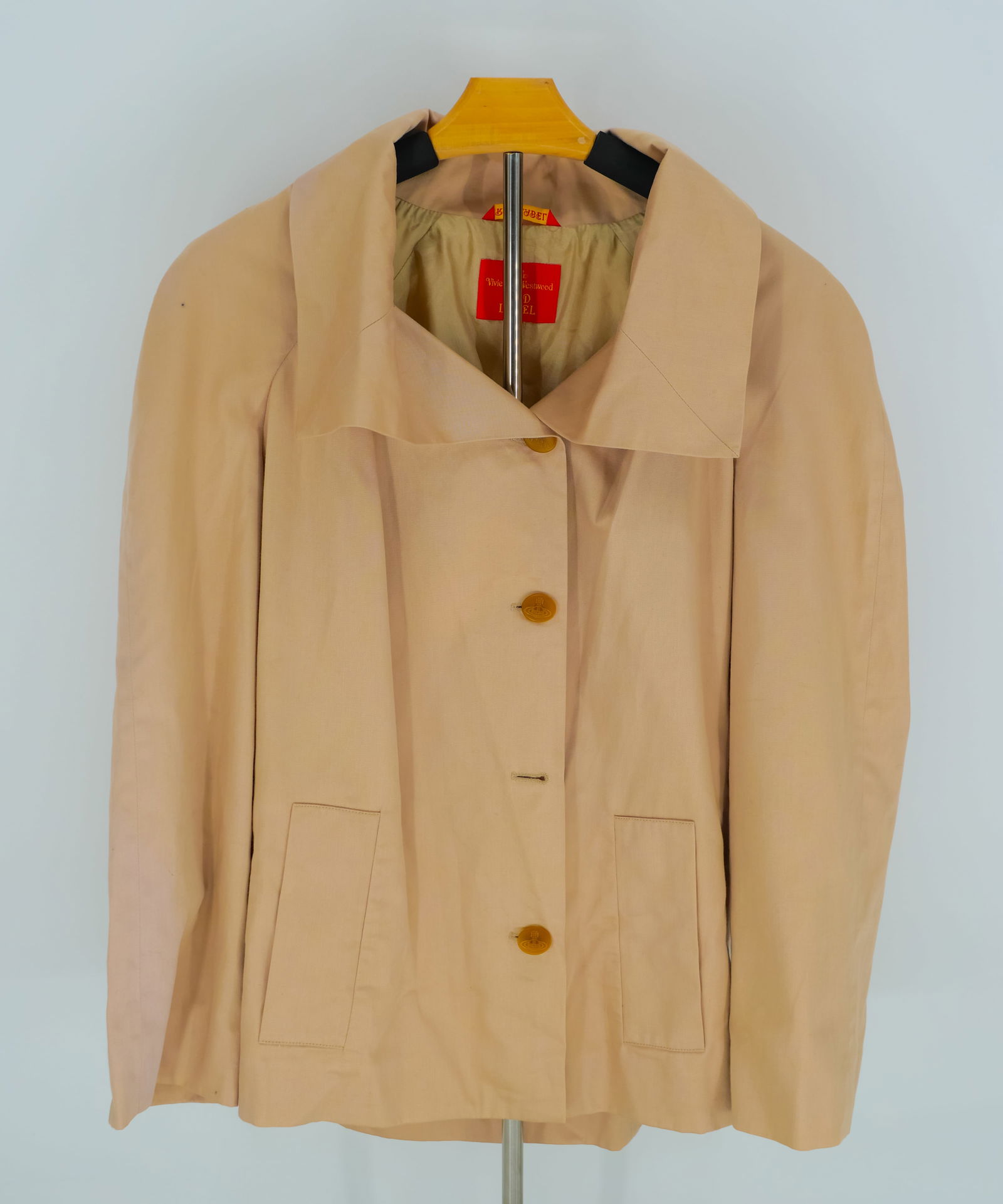 Vivienne Westwood Red Label Nude Cotton Swing Coat - Size 44 IT (L), Rare Archive Piece: A beautifully structured and rare piece from the Vivienne Westwood Red Label collection, this nude-toned swing coat captures the brand’s signature avant-garde tailoring with an understated elegance.