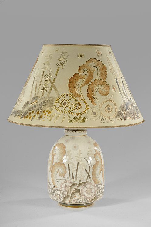 MANUFACTURE NATIONALE DE SÈVRES ET MARCEL PRUNIER: MANUFACTURE NATIONALE DE SÈVRES ET MARCEL PRUNIER (1894-1988)Large ovoid lamp on a circular base. White and gold porcelain with aquatic decoration. Lamp shade as original. Signed and factory seal. Ci