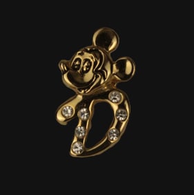 A Gold-toned Mickey Mouse 'D' Hat Pin.