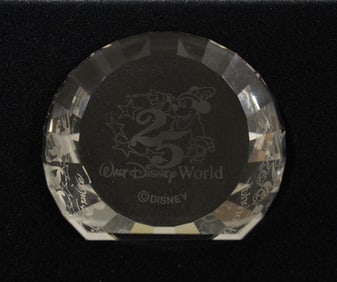 A Walt Disney World 25 Years Celebration faceted Swarovski Crystal Paperweight by Disney Showcase.