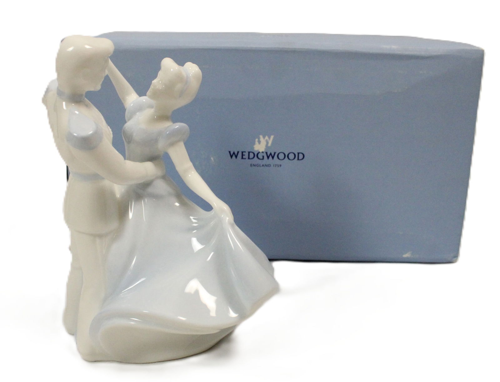 A Limited Edition Wedgewood Cinderella Figurine.: Crafted by Mark Stazaker for Wedgewood, this vintage figurine features Cinderella and Prince Phillip in a beautiful bone china design. The intricate details and delicate dancing pose of the figures ma