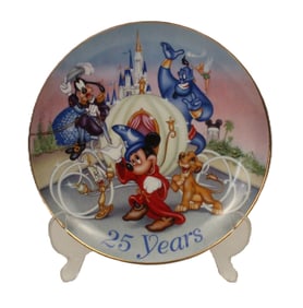 A Walt Disney World 25th Anniversary Decorative Plate.