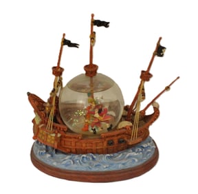 A Peter Pan The Jolly Roger Snow Globe.