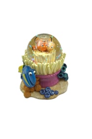A Disney Parks Finding Nemo snow globe.