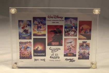 A Walt Disney Feature Animation Florida Cell paperweight.