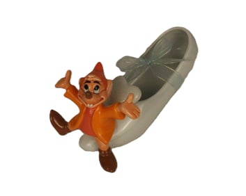 A Porcelain Figure of Jaq Sitting on Cinerella's Glass Slipper.