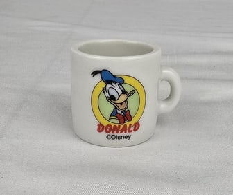 A Miniature Donald Duck Coffee Mug.