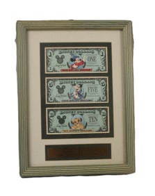 A Framed Matched Set of 25th Anniversary Disney Dollars.