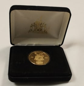 A Disneyland 50th Anniversary Coin.