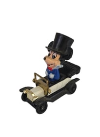 A Vintage Mickey Mouse Character In A Toy Car.