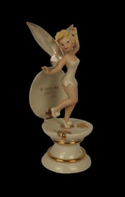 A Tinker Bell Figurine by Lenox.