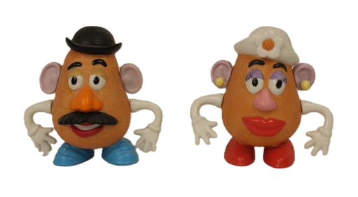 A 2-Piece Ceramic Mr. And Mrs. Potato Head Figurine Set.