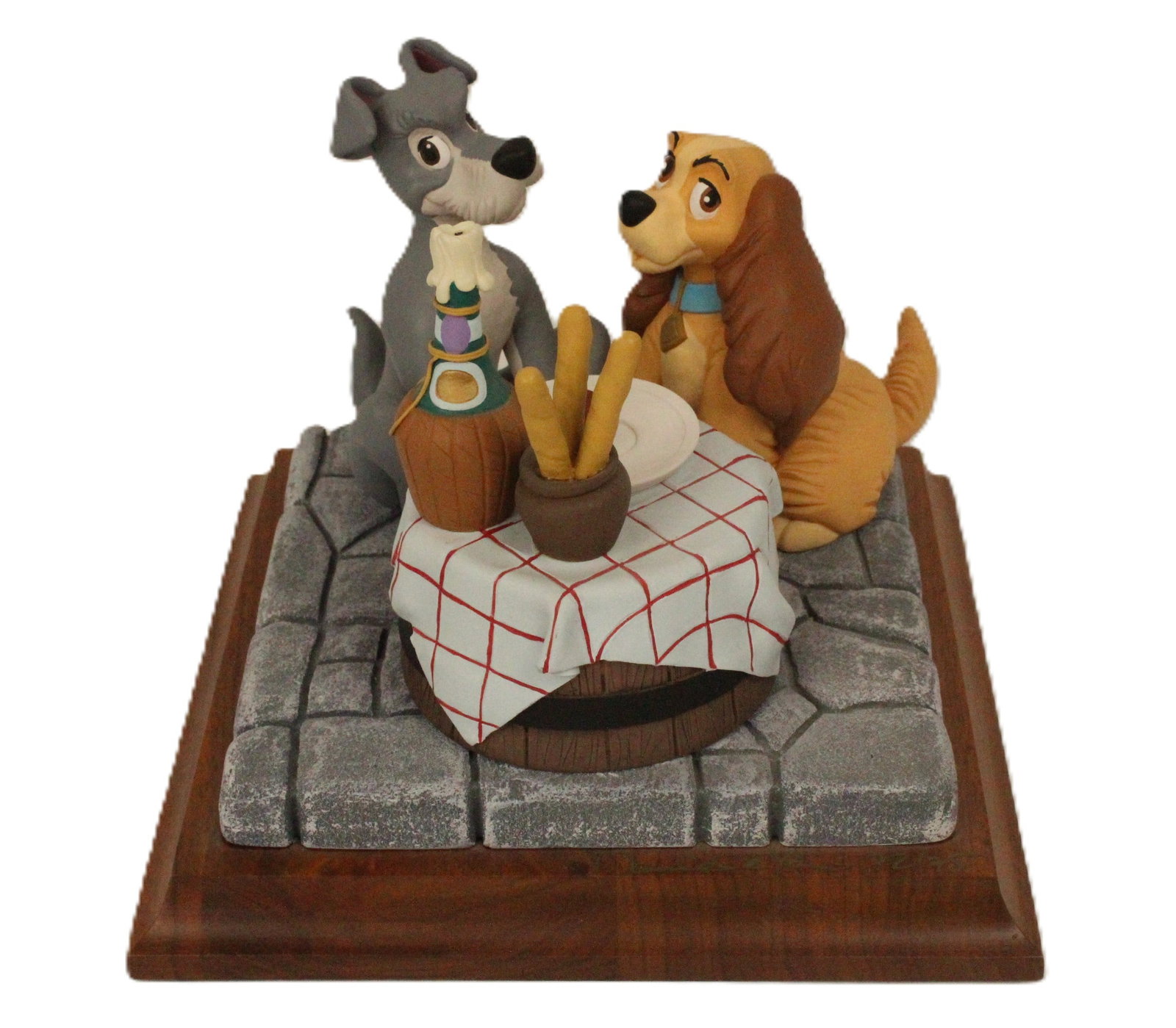 A Limited Edition and Autographed Lady and The Tramp Figurine.: (Border Fine Arts) This piece if from the Disney A Moment in Time Collection. Created by David Kracov, this beautiful piece captures the iconic Bella Notte scene from the film. This is hand signed and