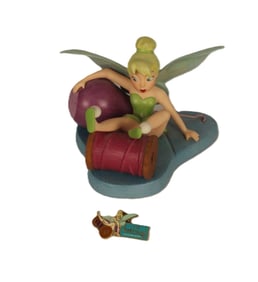 A WDCC Tinkerbell Figurine And Matching Pin.