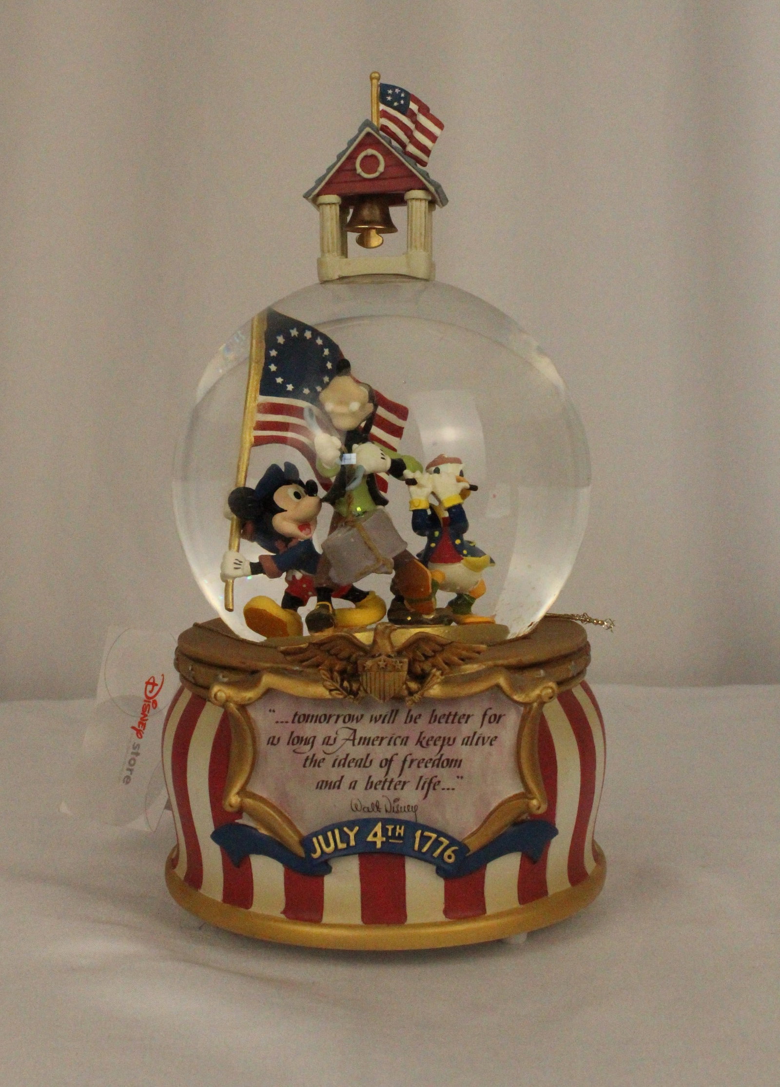 A 4th Of July 1776 Snow Globe.: (Disney Store) This snow globe is part of the holiday series and represents July 4th 1776. It features patriotic colors and a plaques that shares a quote from Walt Disney. ?...tomorrow will be better 